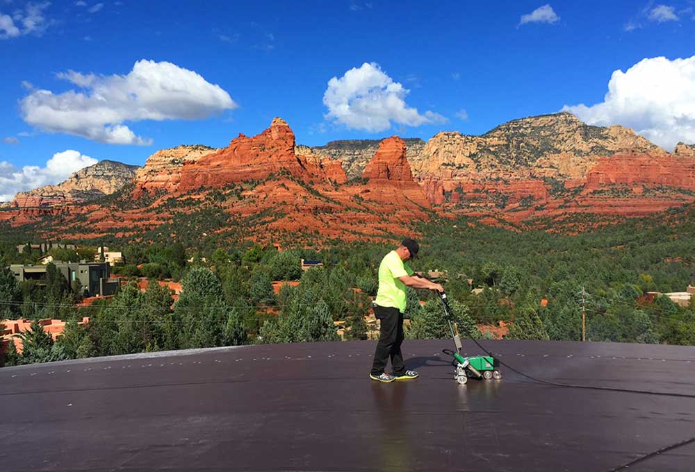 Man working on commercial roofing project in Sedona Arizona