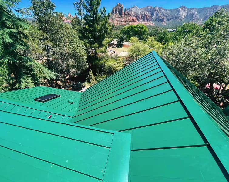 A metal roof on a home in Sedonas Arizona. This image helps illustrate that there are several different types of matal roofing materials available.