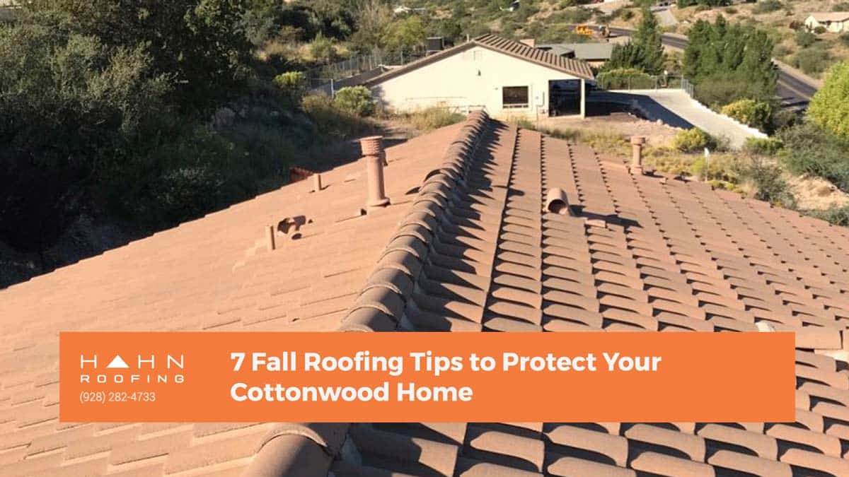 A close-up view of a terracotta-tiled roof on a Cottonwood home, overlooking a residential area. From Hahn Roofing's "7 Fall Roofing Tips to Protect Your Cottonwood Home."