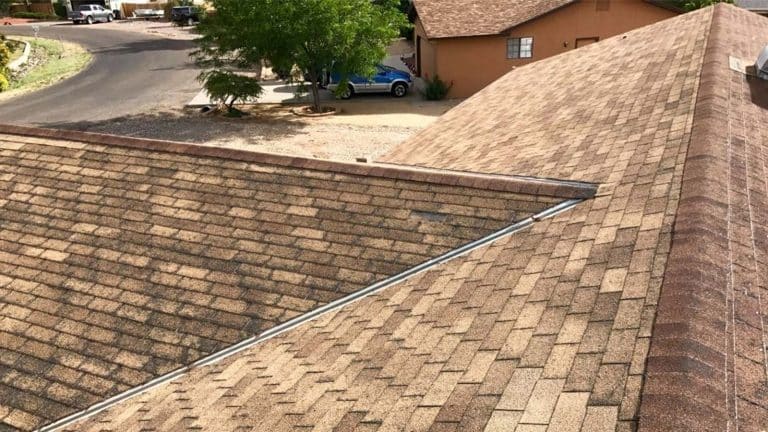 A Sedona neighborhood with a clean, well-maintained shingle roof, emphasizing key roof care practices. From the blog post "9 Essential Roof Maintenance Tips for Sedona Homeowners" by Hahn Roofing.