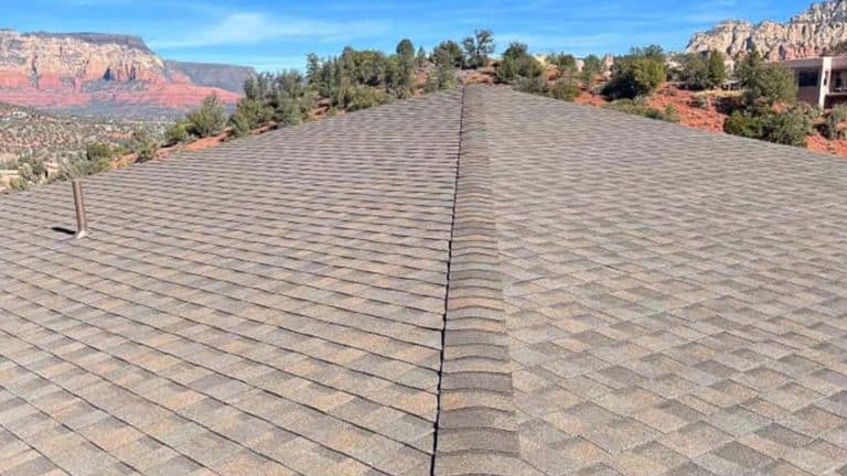 A panoramic view of a Cottonwood home's asphalt shingle roof, set against red rock formations. From Hahn Roofing's "How to Increase Curb Appeal with a New Roof in Cottonwood, AZ."