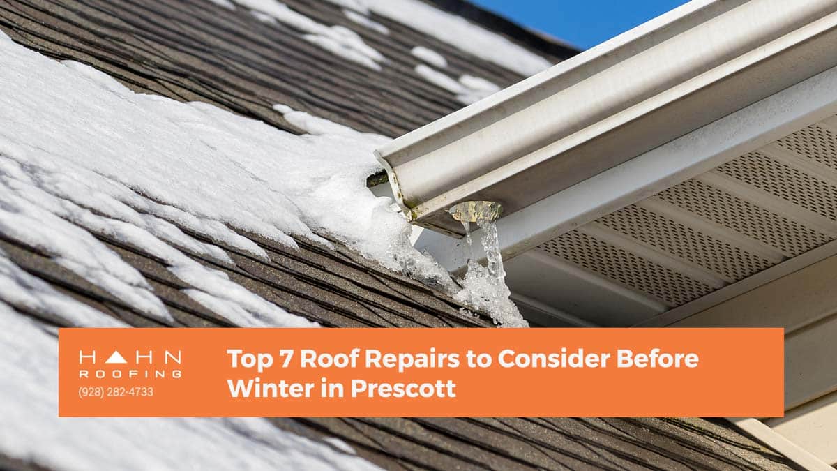 An icy gutter on a sloped roof in Prescott, showcasing common winter roof repairs. From the blog post "Top 7 Roof Repairs to Consider Before Winter in Prescott" by Hahn Roofing